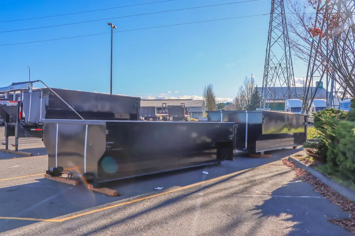 Roll-off dumpster ready for waste disposal at job site for Concrete Dumpster Rental in Avon